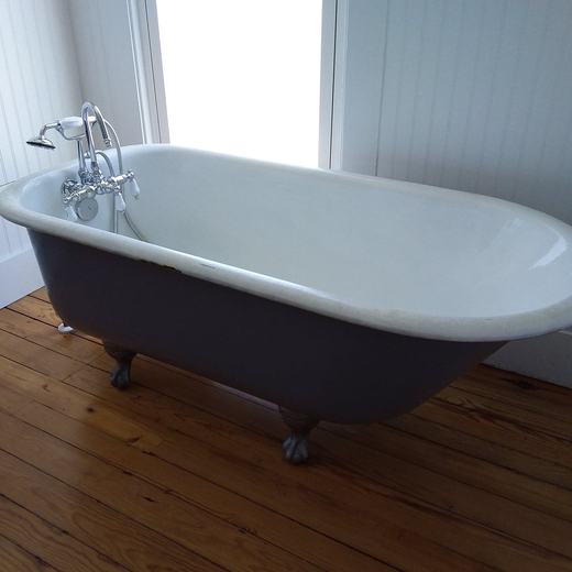 Restored clawfoot tub installation