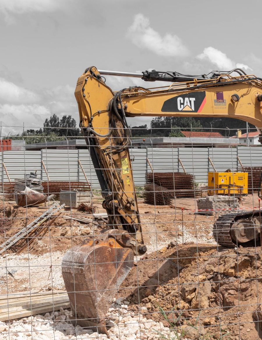 Excavator digging for a sewer line replacement