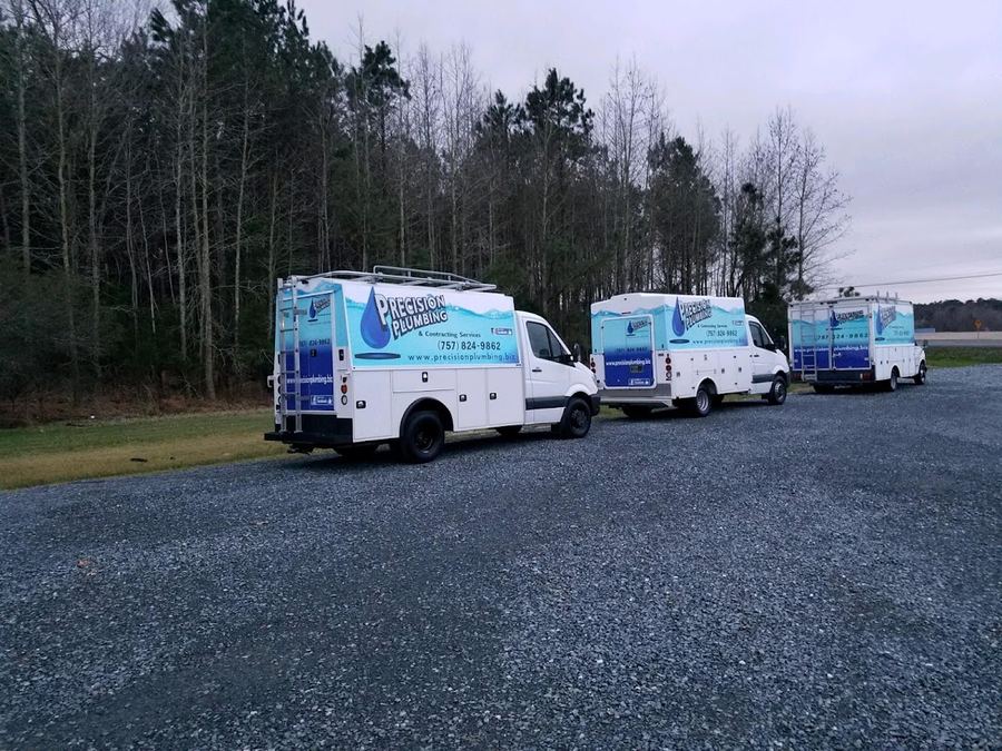 The Precision Plumbing service fleet, ready across the Shore