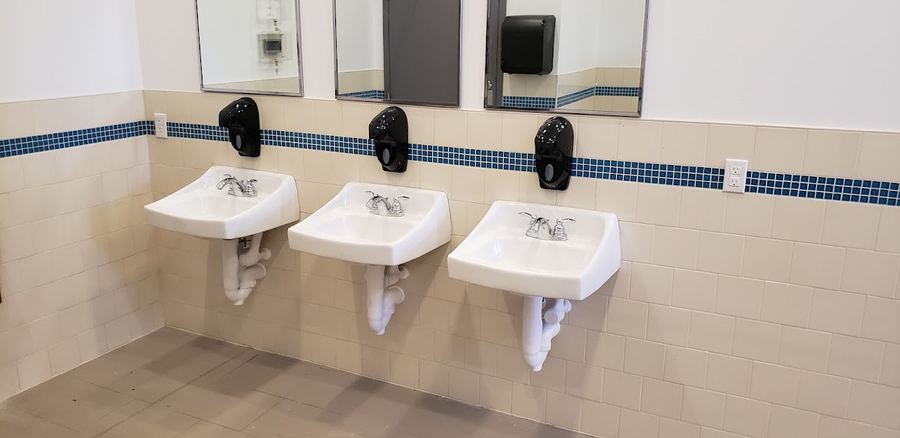 Commercial restroom fixtures installed by Precision Plumbing
